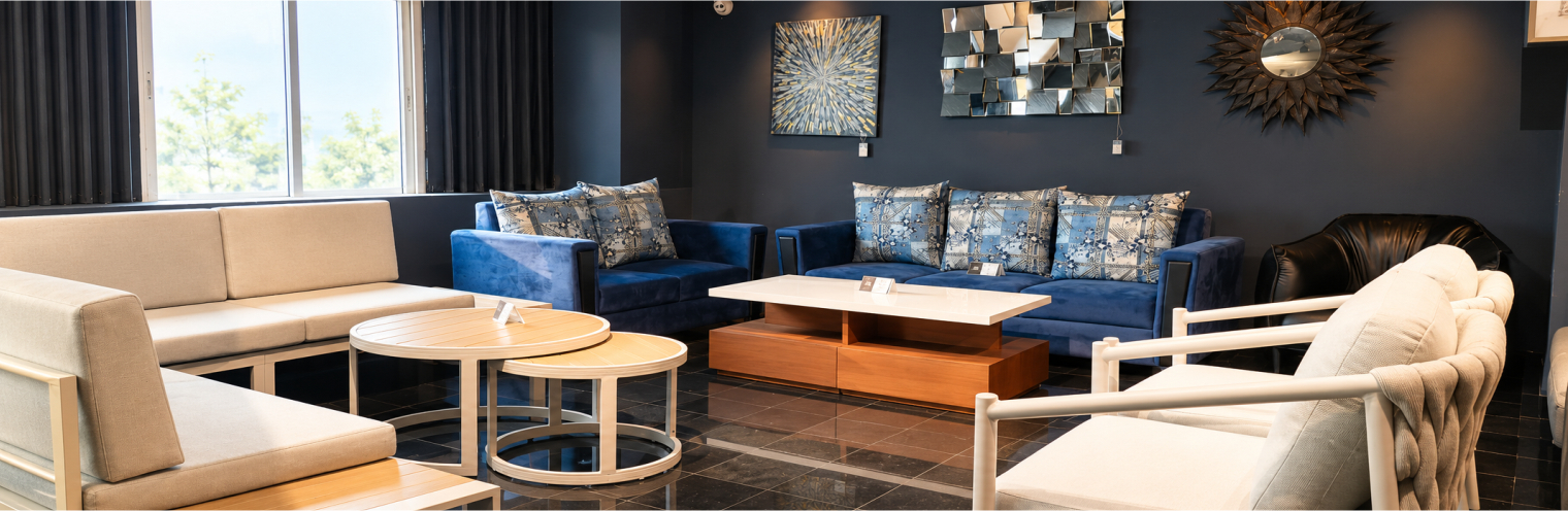 Beige sofa with a round walnut coffee table