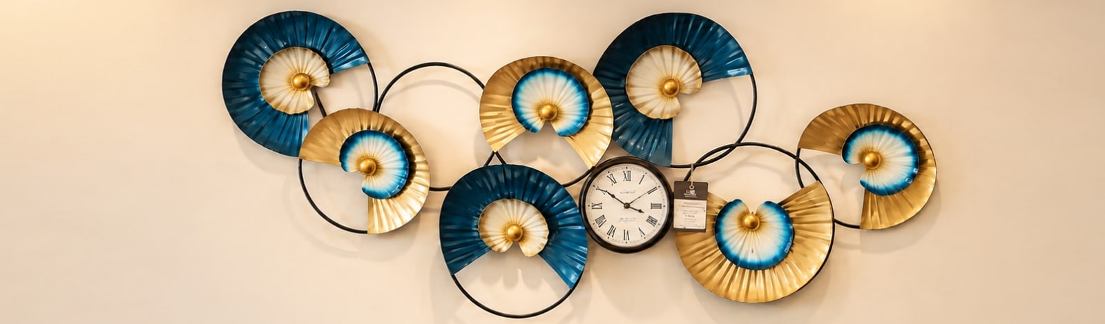 Decorative wall artefact with a clock